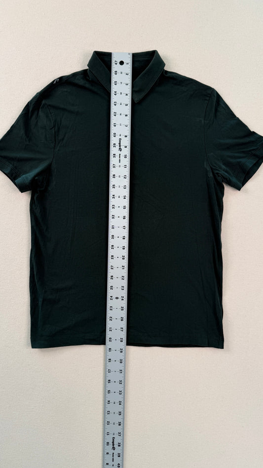 Black shirt with a measuring tape on a beige background