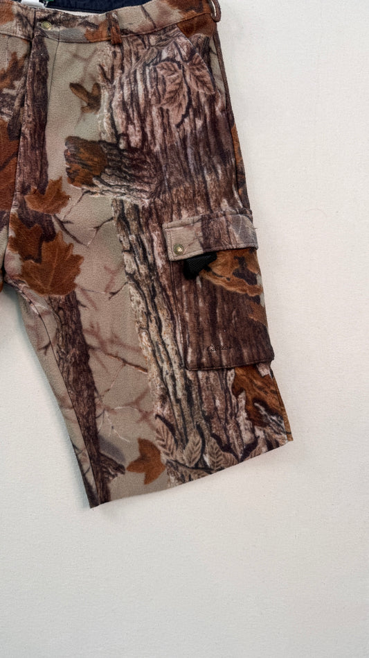 Camouflage cargo pants on a white background
