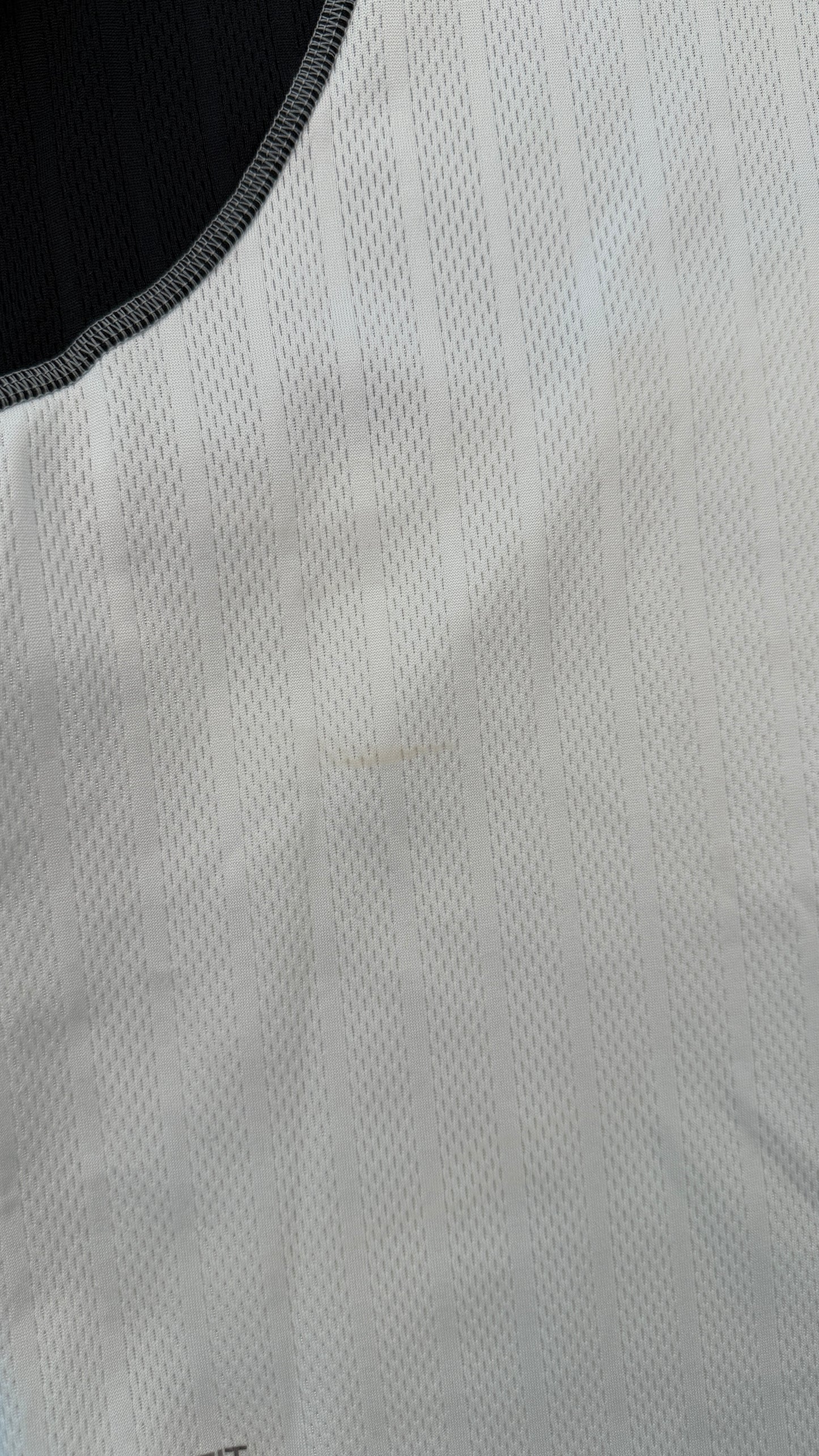 Close-up of a textured gray fabric with a black border