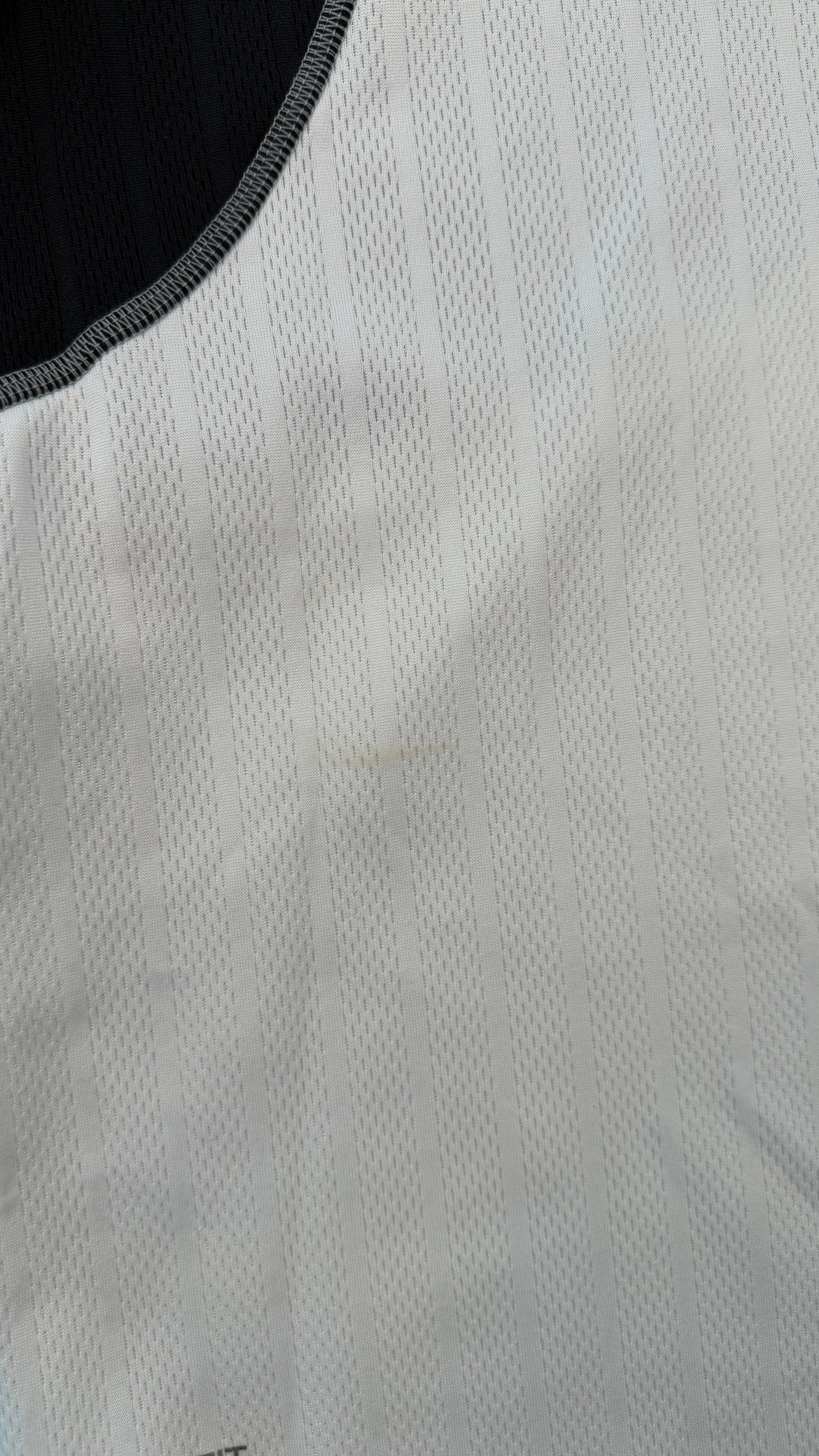 Close-up of a textured gray fabric with a black border