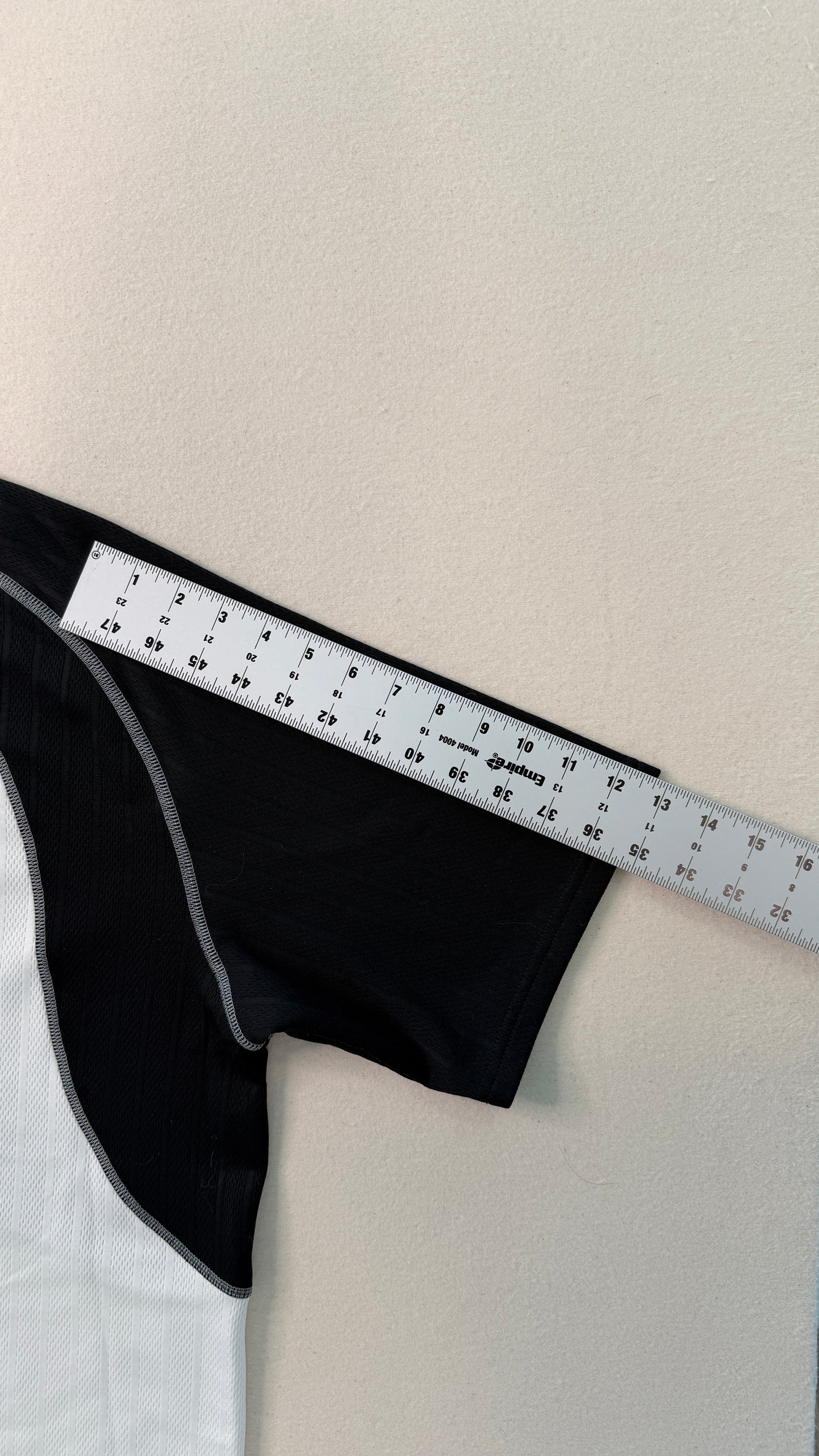 Black fabric with a ruler on a white background