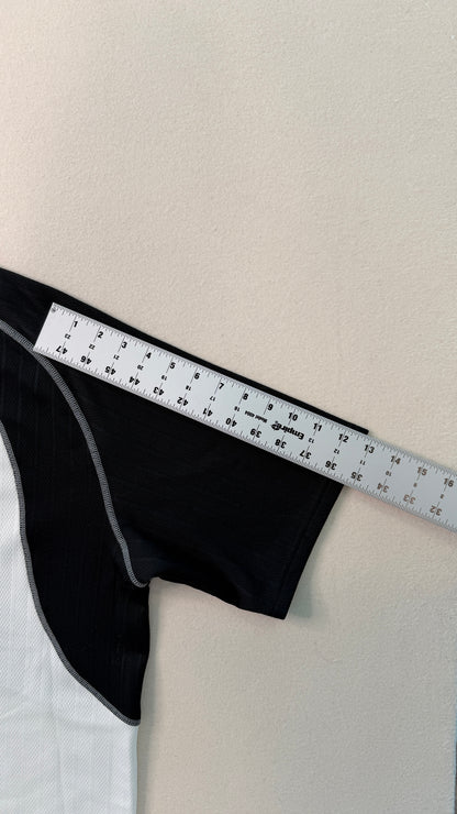 Black fabric with a ruler on a white background