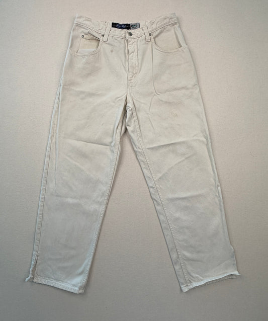 Beige jeans on a gray background