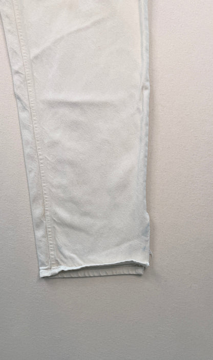 Close-up of light-colored pants on a white background