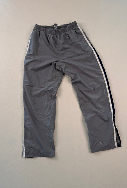Gray pants with white stripes on a light gray background