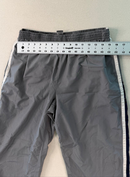 Gray pants with a measuring tape on a white background