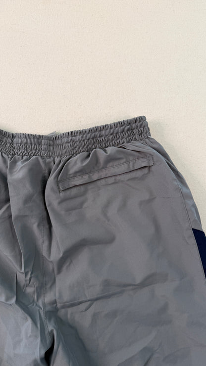 Gray pants with a pocket on a light beige background