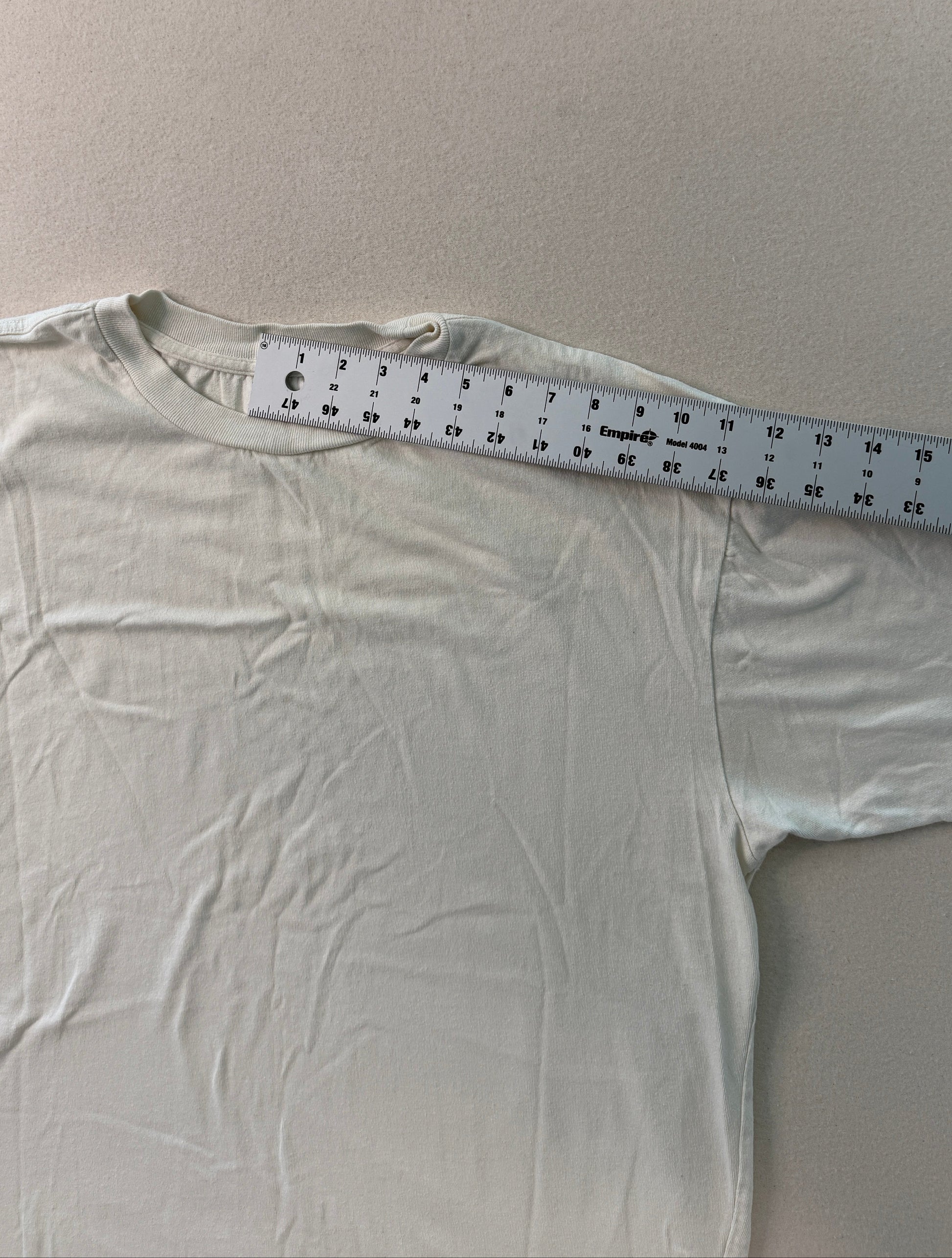 White shirt with a ruler on a light gray background