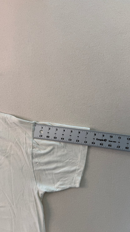 White fabric with a ruler on a plain background