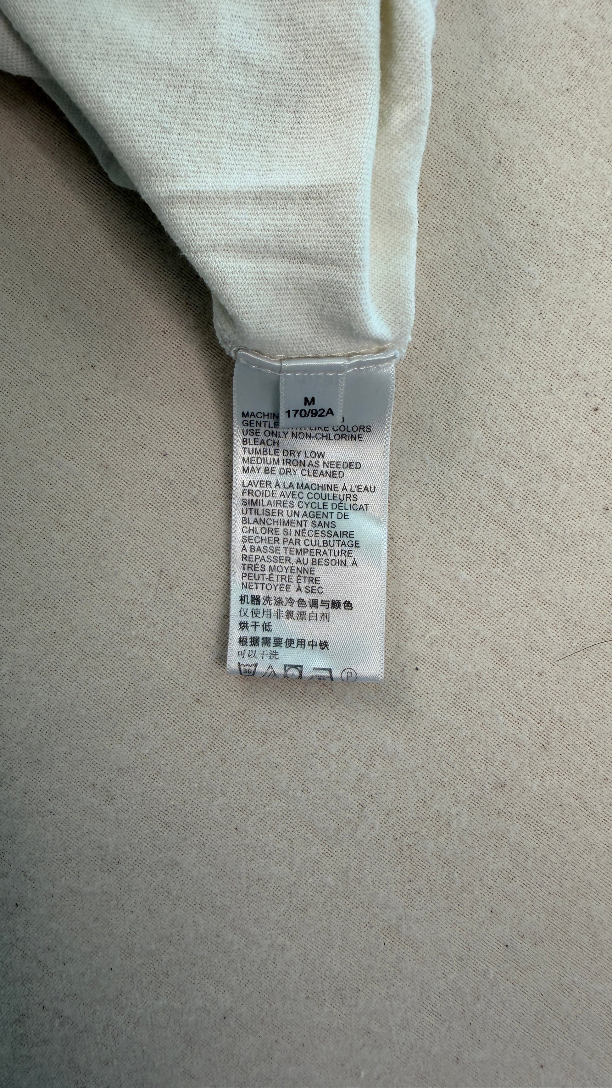 Textile label on a beige fabric background