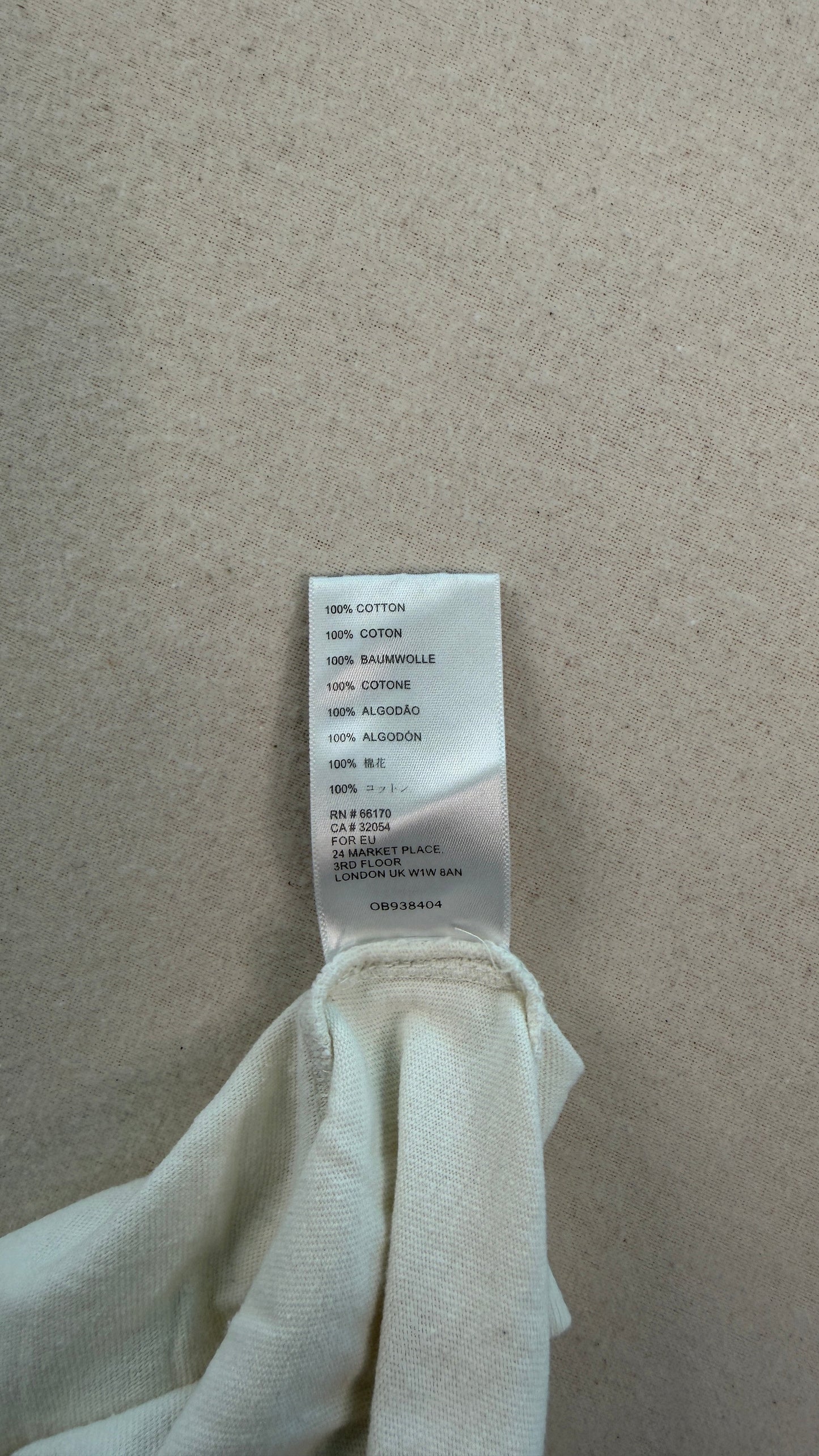 Clothing tag on a white fabric background
