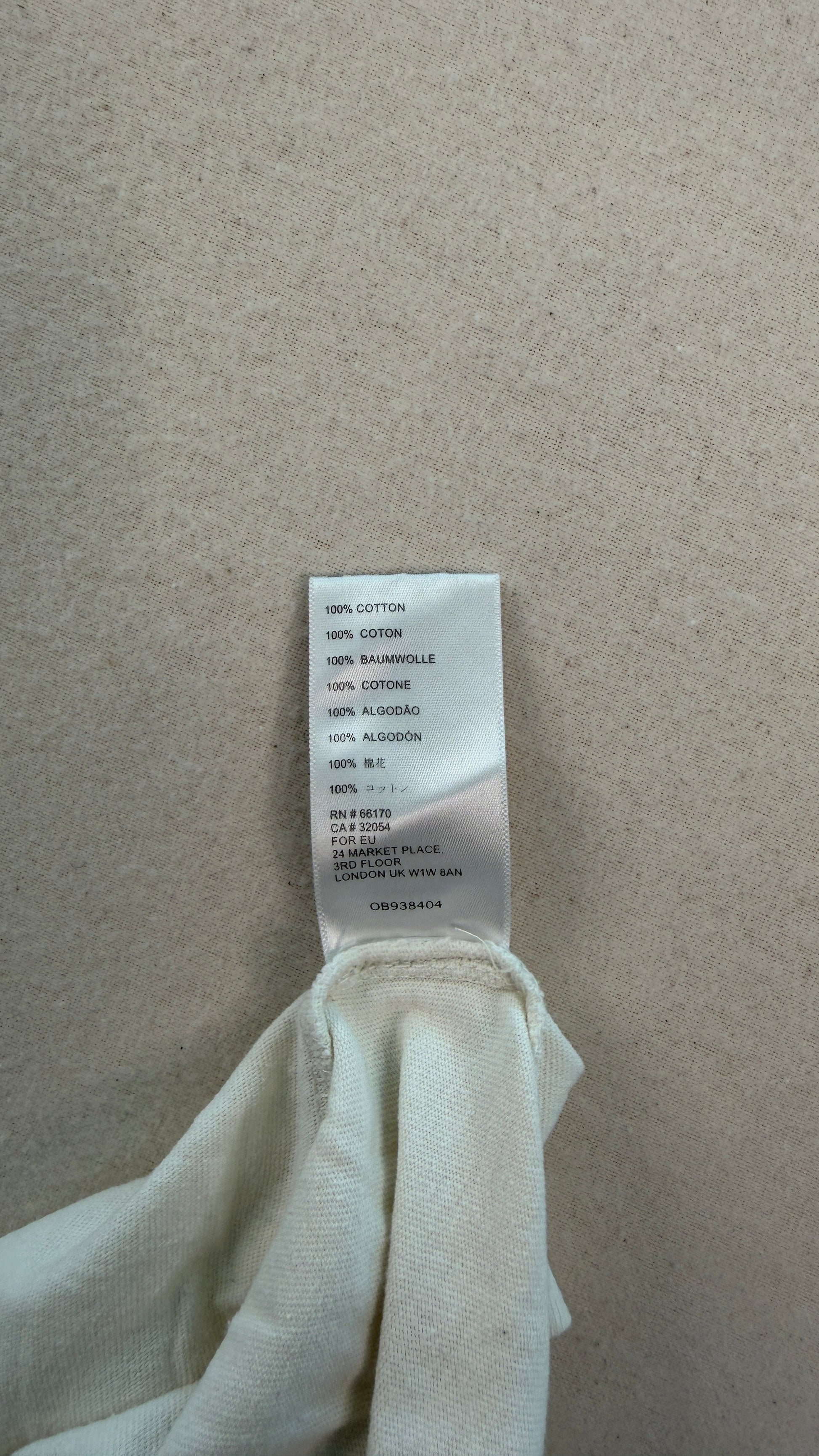 Clothing tag on a white fabric background