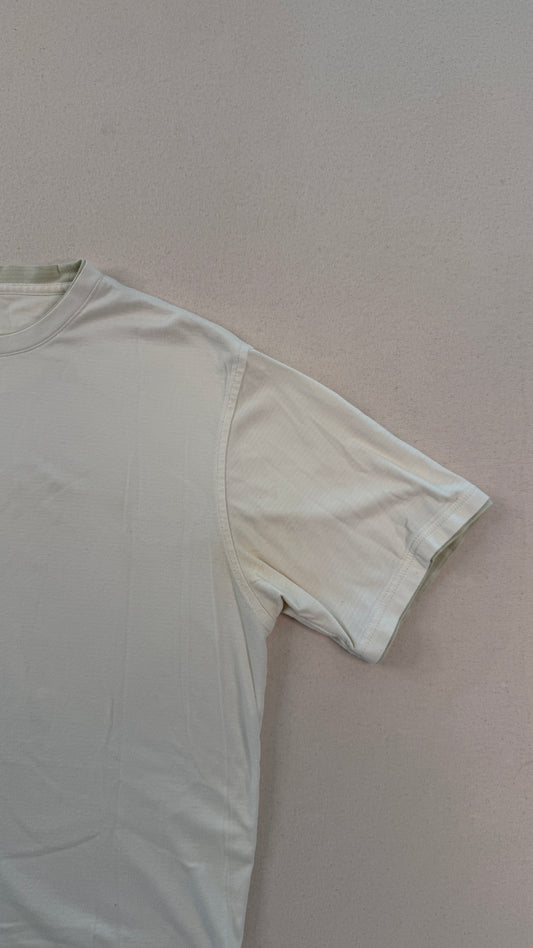 White t-shirt on a light pink background