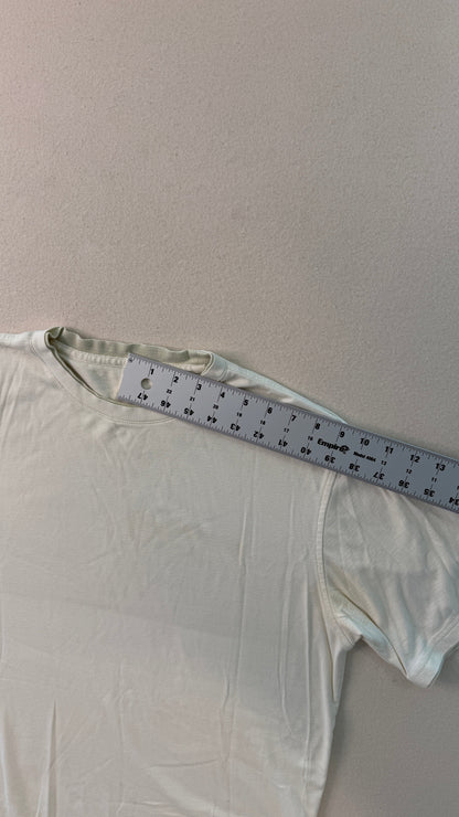 White shirt with a measuring tape on a gray background