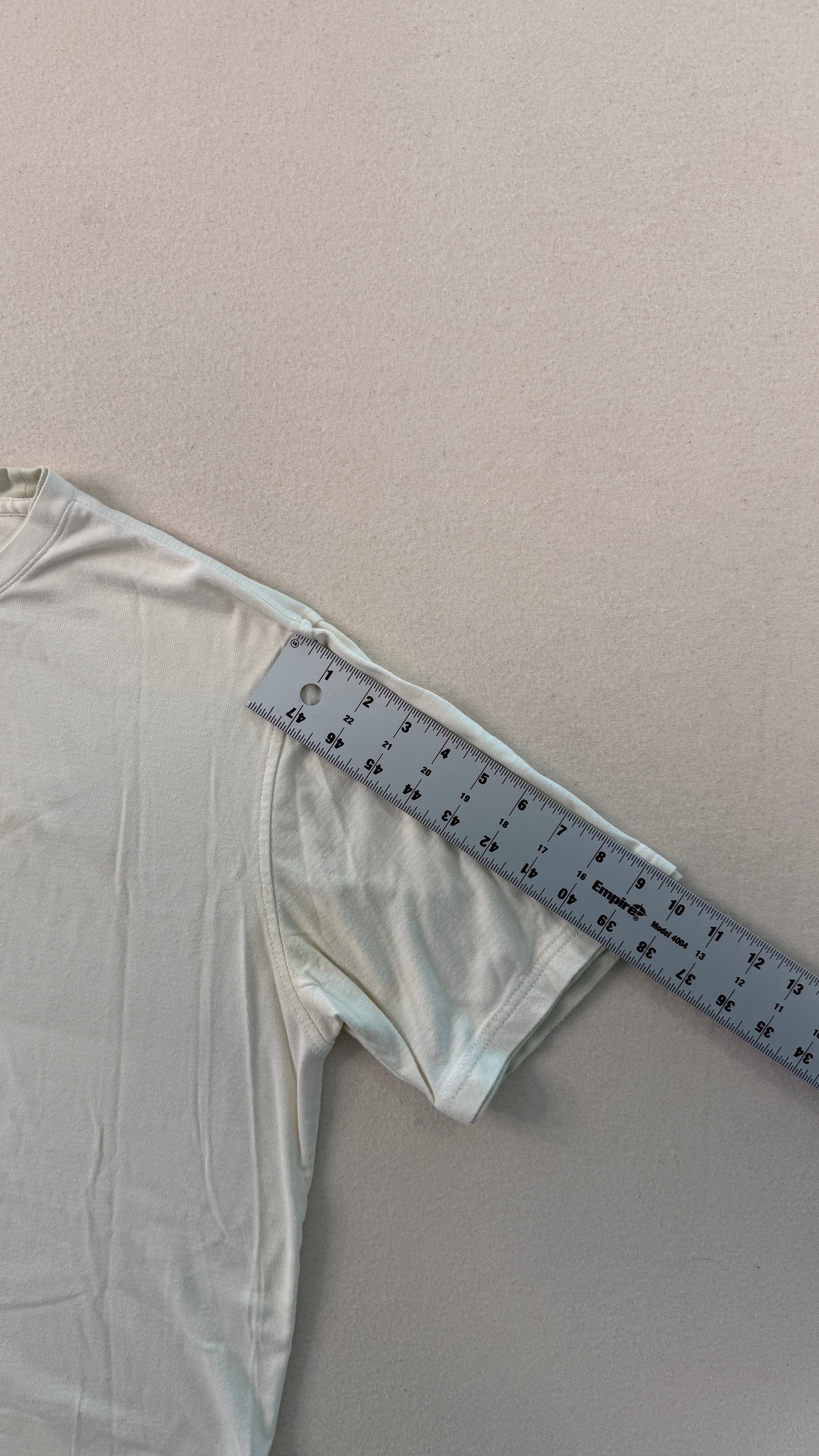 White fabric with a ruler on a gray background