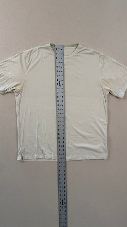 White long-sleeve shirt with a ruler for size reference on a plain background