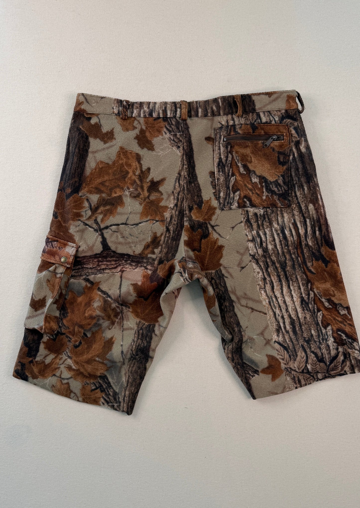 Camouflage-patterned pants on a white background