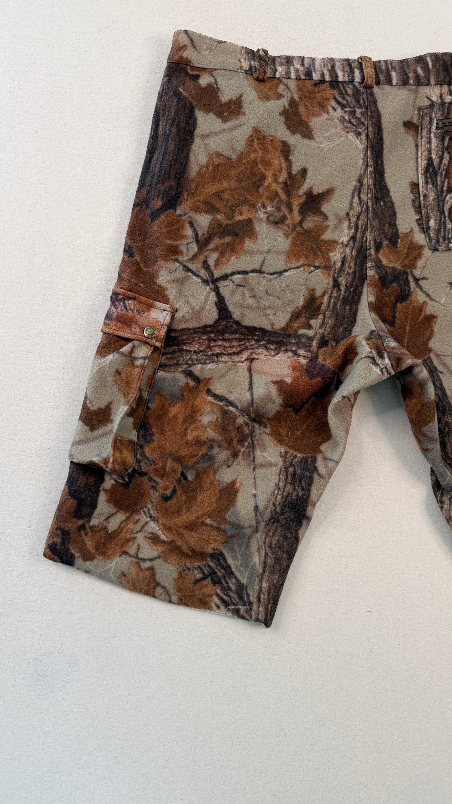 Camouflage-patterned pants on a white background