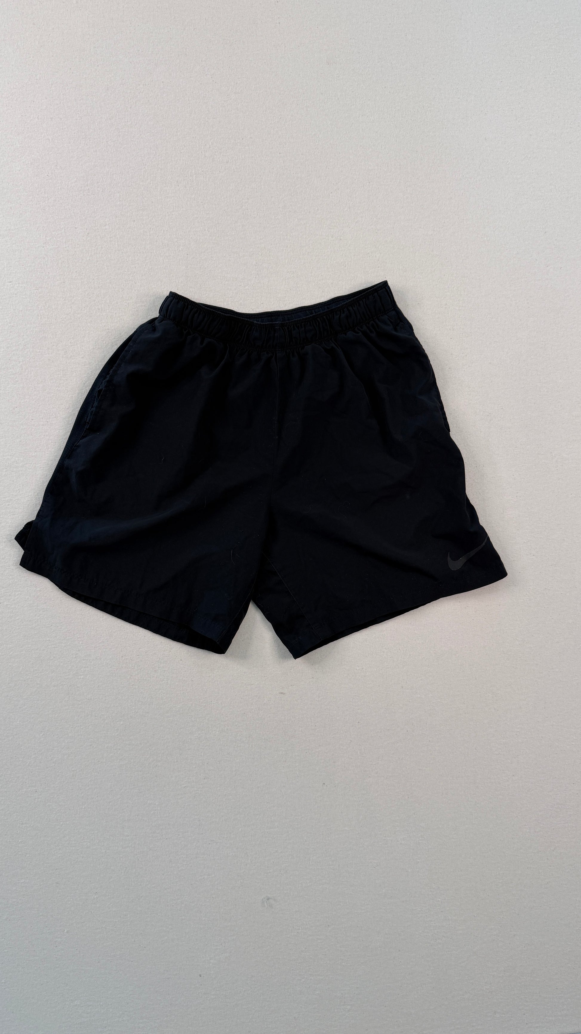 Black shorts on a light gray background