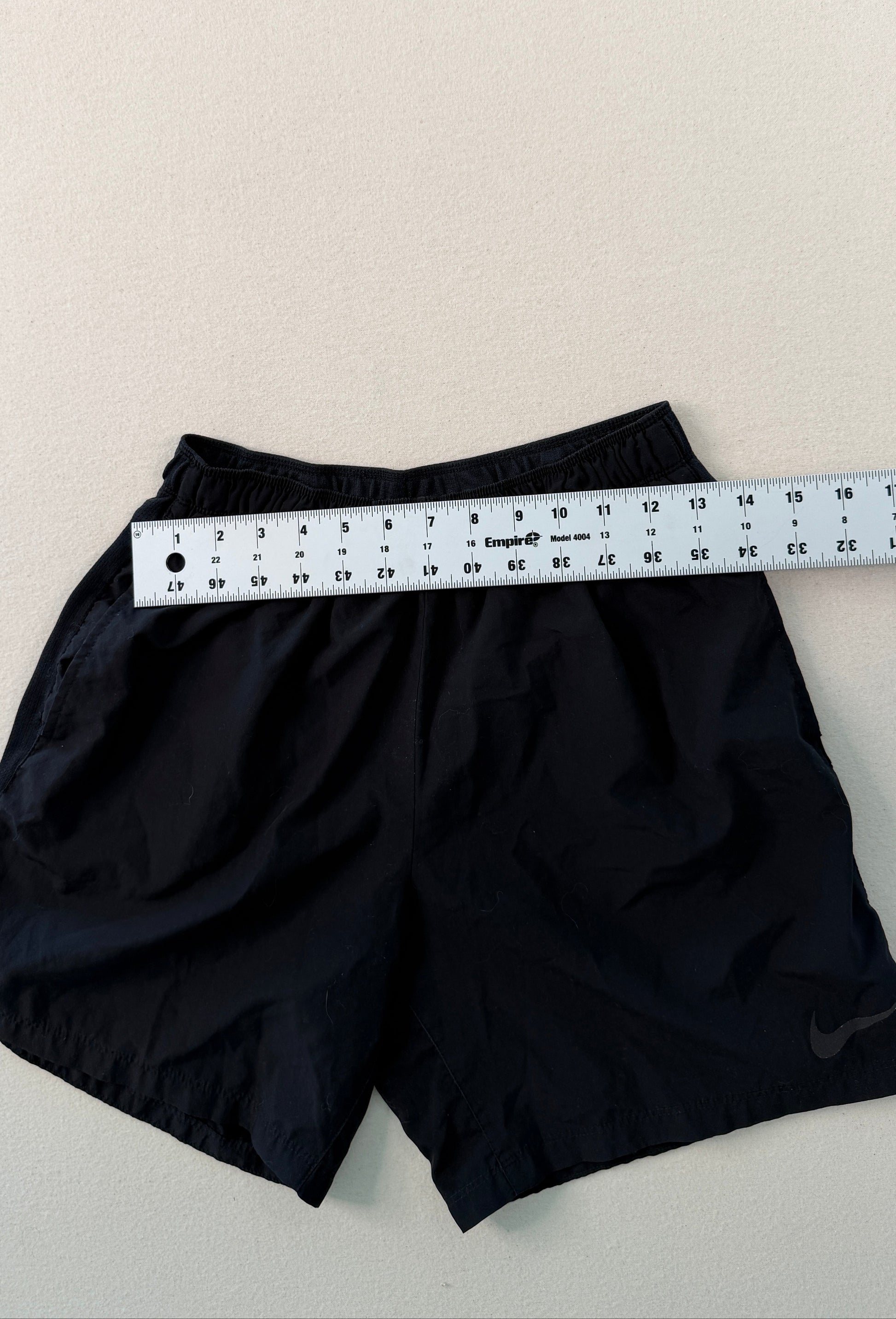 Black fabric with a measuring tape on a light background