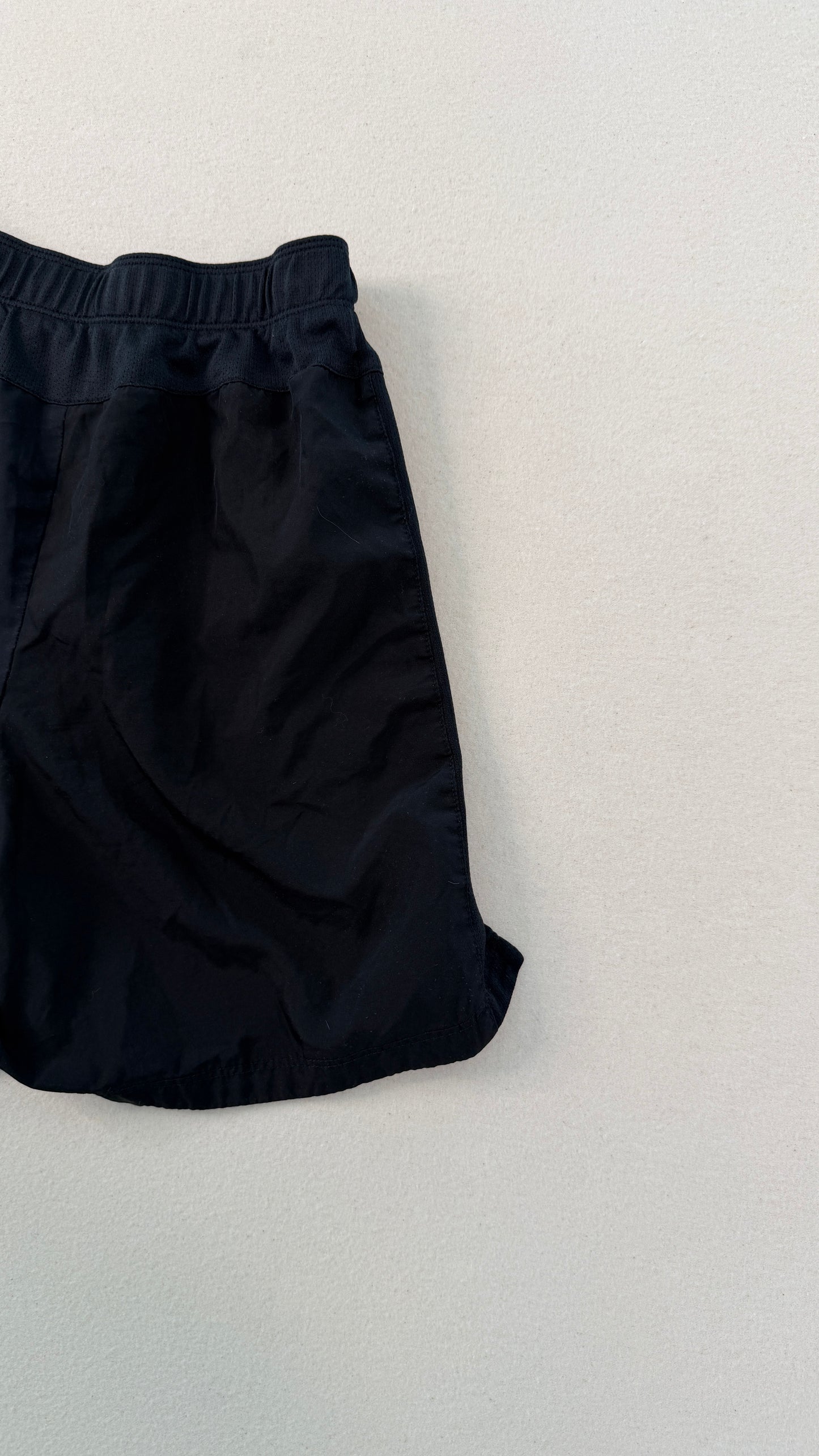 Black pants on a light gray background