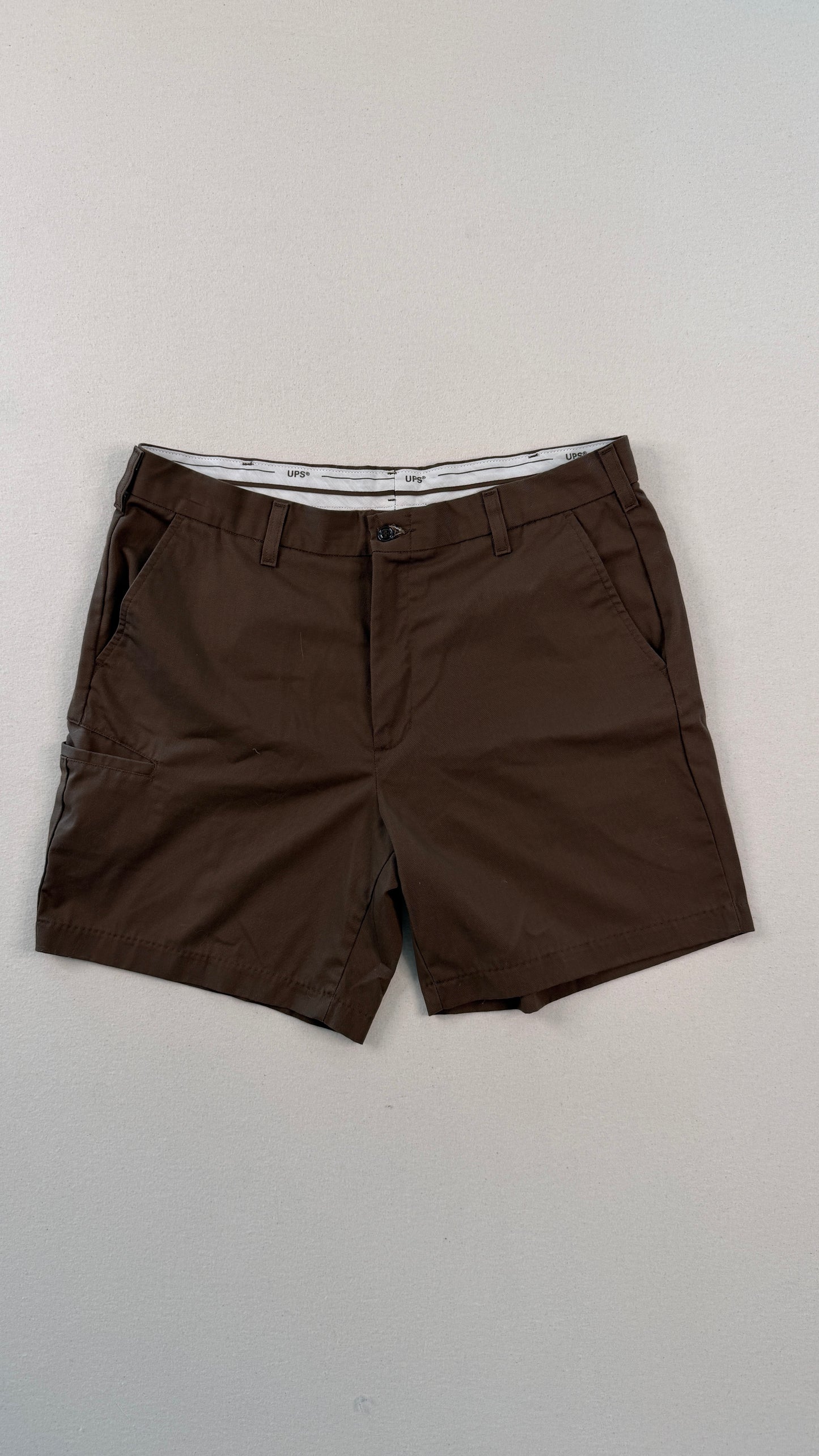 Brown shorts on a light gray background