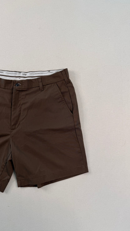 Brown shorts on a light gray background