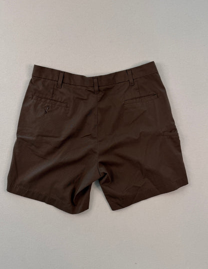 Brown shorts on a light gray surface with a ruler at the bottom.