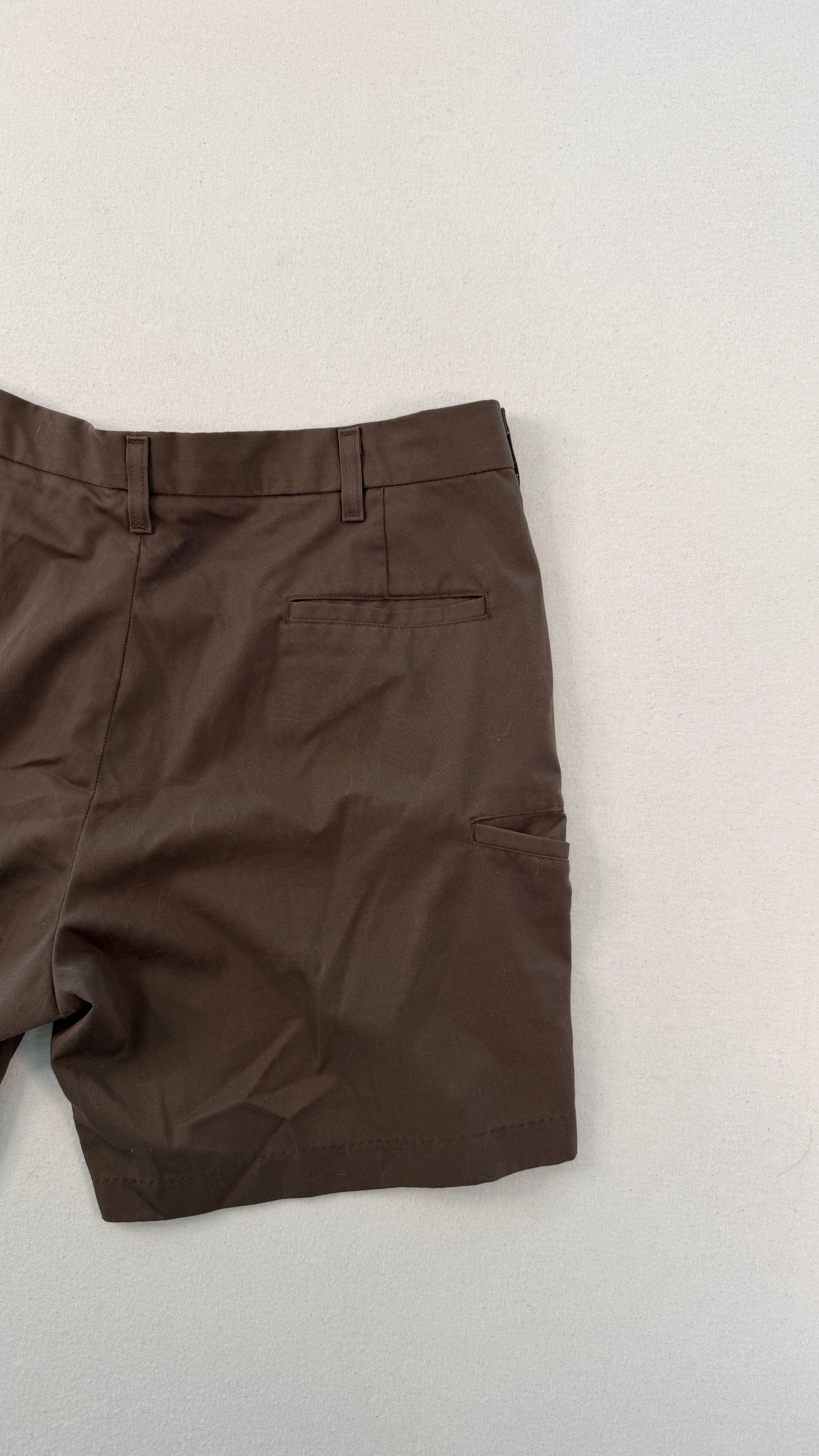 Brown shorts on a light gray background